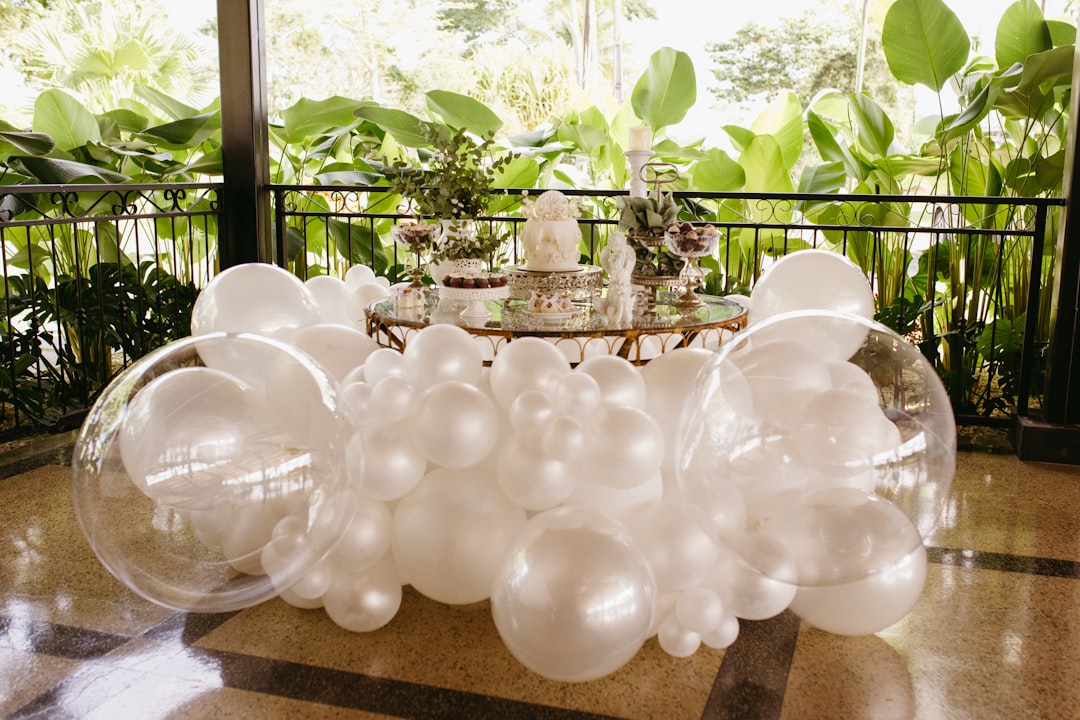 Elegant bridal shower setup with floral arrangements and table settings