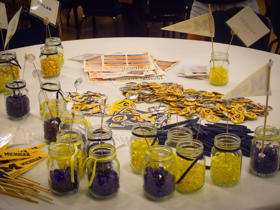 A vibrant game day party scene with snacks, drinks, and fans cheering in a cozy living room or backyard setting.