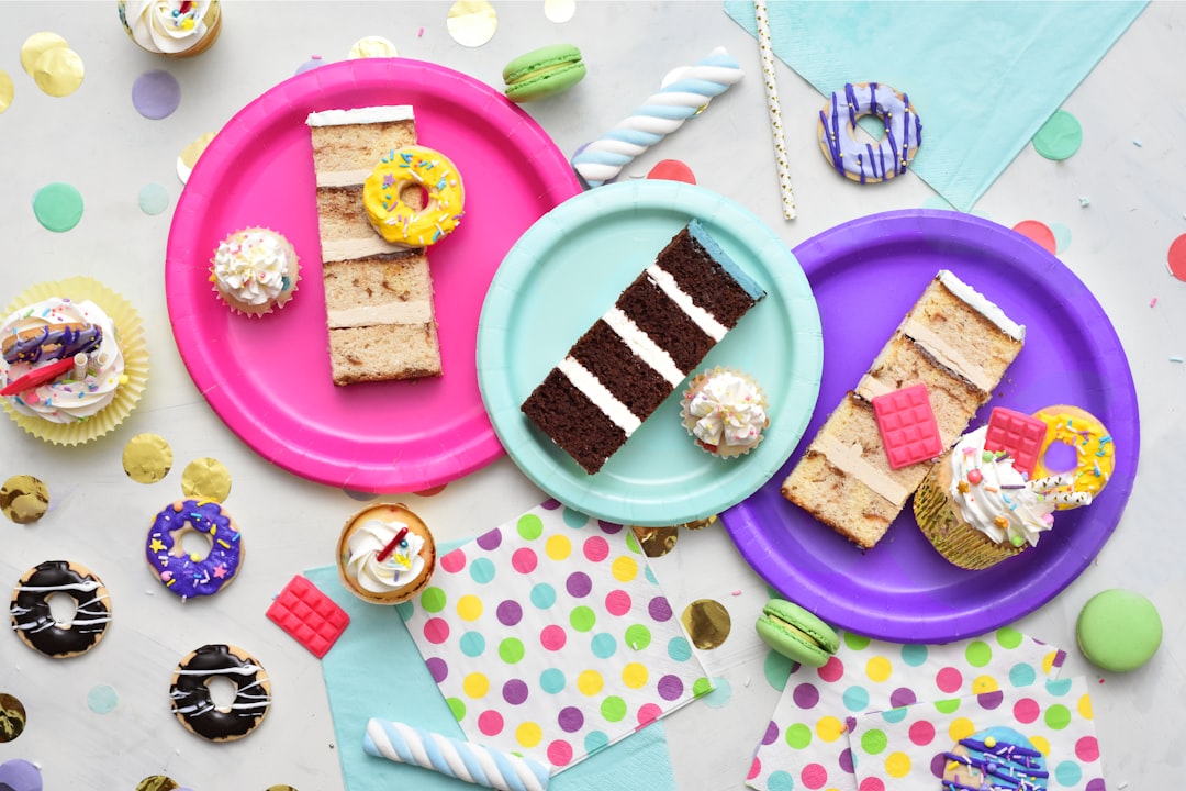 A beautifully set table with matching plates, cups, napkins, and a tablecloth, showcasing a cohesive and stylish party setup.