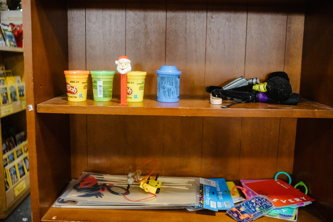 A neatly organized shelf or storage area filled with colorful party supplies such as balloons, plates, and decorations, showcasing an inviting and festive atmosphere.